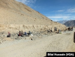 Constriction workers are seen working in North Pullu, Khardung La, on a road site in Leh, India.