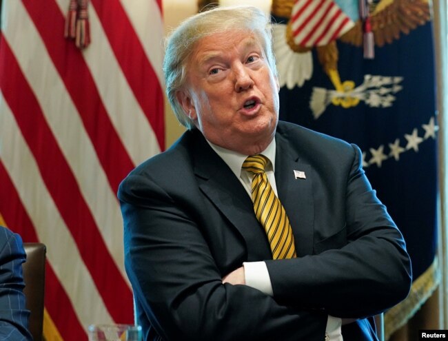 U.S. President Donald Trump speaks during a meeting in the Cabinet room at the White House in Washington, April 4, 2019.