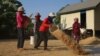 FILE: Villagers in Kampong Thom province were drying rice in front of his house in Kampong Thom province, January 19, 2019. (Sun Narin/VOA Khmer)