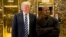 President-elect Donald Trump and Kanye West are pictured in the lobby of Trump Tower in New York, Dec. 13, 2016.