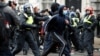 Demonstrators clash with police officers on Whitehall during a Black Lives Matter protest near Downing street in London, following the death of George Floyd who died in police custody in Minneapolis, June 6, 2020.