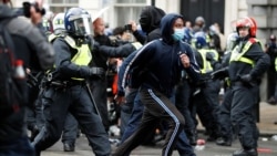 Demonstrators clash with police officers on Whitehall during a Black Lives Matter protest near Downing street in London, following the death of George Floyd who died in police custody in Minneapolis, June 6, 2020.