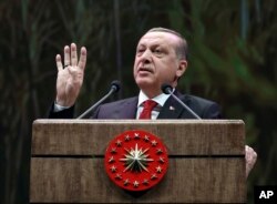 Turkey's President Recep Tayyip Erdogan addresses a group of farmers, in Ankara, Turkey, Monday, Nov. 14, 2016.