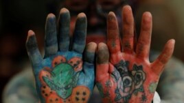 Author Hiroki Takamura, 62, shows tattoos on his palms at the annual gathering of the Irezumi Aikokai (Tattoo Lovers Association) in Tokyo, Japan, February 16, 2020. REUTERS/Kim Kyung-Hoon