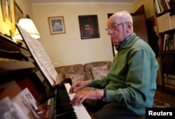 Pedro Rodriguez, 106, plays piano at his home in Cangas de Onis, Asturias, in northern Spain, July 9, 2016.