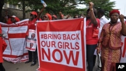 FILE - Scores of protesters chant "Bring Back Our Girls," about Nigerian students kidnapped by Boko Haram in April 2014.