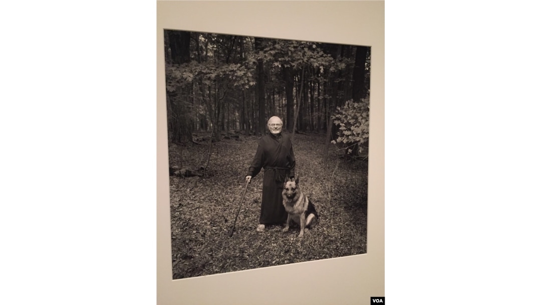 In this portrait, beloved children’s book author Maurice Sendak poses with his dog, Herman. (J.Taboh/VOA)