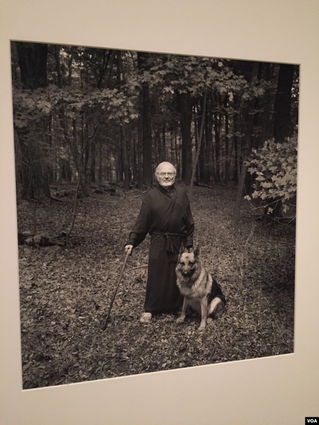 In this portrait, beloved children’s book author Maurice Sendak poses with his dog, Herman. (J.Taboh/VOA)