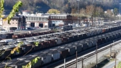 FILE - Coal cars fill a rail yard in Williamson, W.Va., Nov. 11, 2016. The coal mining industry has been shriveling for decades, as demand for coal across the United States decreases.