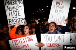 Demonstrators protest outside of City Hall following the election of Republican Donald Trump as President of the United States in downtown Los Angeles, California, Nov. 10, 2016.