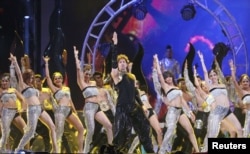 FILE - Bollywood actor Hrithik Roshan performs during the 15th International Indian Film Academy Awards in Tampa, Florida, April 26, 2014.