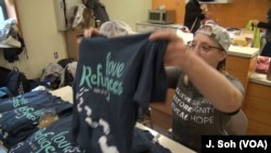 T-shirt sales contribute to the Love Week effort to help refugees.