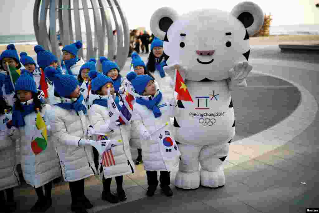 Children look on the 2018 PyeongChang Winter Olympics mascot Soohorang in Gangneung, South Korea, February 8, 2018.