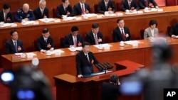 Chinese President Xi Jinping delivers a speech at the closing session of the annual National People's Congress (NPC) at the Great Hall of the People in Beijing, Tuesday, March 20, 2018.