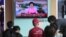 People watch a TV news report about North Korea's hydrogen bomb test at a railway station in Seoul, South Korea, Sept. 3, 2017. 