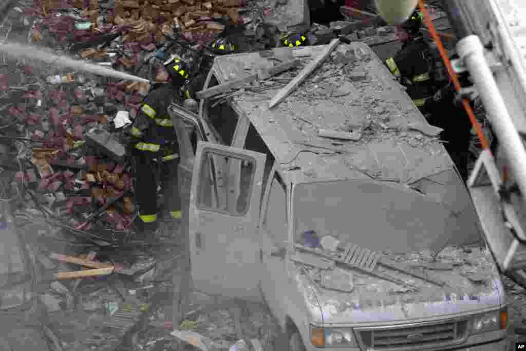 Firefighters respond to a fire in Harlem after a building exploded, March 12, 2014.