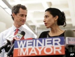 Anthony Weiner with wife, Huma Abedin, in 2013. Abedin recently announced that the couple is separating.