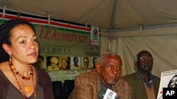 Kenya Human Rights Commission Official Muthoni Wanyeki (left) and others take part in a news conference in Kenya's capital Nairobi, July 21, 2011.