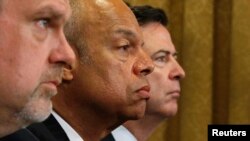 FILE - From left, U.S. National Counterterrorism Center Director Nicholas Rasmussen, Homeland Security Secretary Jeh Johnson and FBI Director James Comey testify before a House Homeland Security Committee hearing on Capitol Hill in Washington, July 14, 2016. 