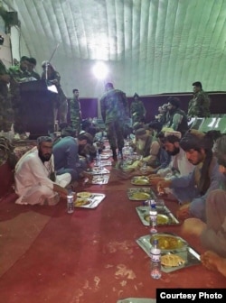 Prisoners freed from Taliban prisons in Helmand dine at an Afghan military facility. (MOD)