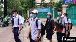 High school students leave after their first day of classes, as the government eased the nationwide lockdown during the coronavirus disease (COVID-19) outbreak in Ho Chi Minh, Vietnam May 5, 2020. (REUTERS/Yen Duong)