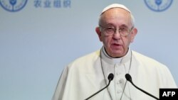 FILE - Pope Francis delivers a speech in Rome, Oct. 16, 2017.