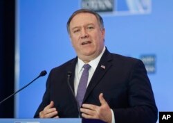 Secretary of State Mike Pompeo gestures while speaking during a news conference at the U.S. State Department in Washington, April 4, 2019.