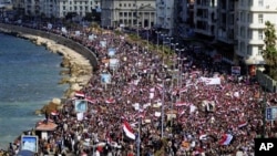 Tens of thousands of Egyptian anti-government protesters celebrate in Alexandria, Egypt, February 11, 2011