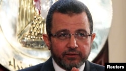 Egyptian Prime Minister Hisham Kandil speaks during a news conference in Cairo, December 30, 2012.
