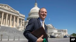 FILE - Rep. Adam Schiff, D-Calif., Chairman of the House Intelligence Committee, walks across the plaza on Capitol Hill in Washington.