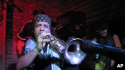 Frank London blows his horn for Haiti Relief at Mehanata, an alternative club in New York.