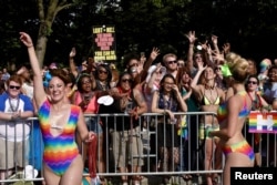 A religious group holds up a sign in protest during the DC Capital Pride parade in the Dupont Circle neighborhood in Washington, June 11, 2016.