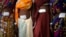 Women who underwent surgery at a government mass sterilization camp pose for pictures inside hospital, Bilaspur district in the eastern Indian state of Chhattisgarh, India, Nov. 14, 2014.