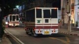 (FILE) This photo provided by Thailand's daily web newspaper Prachatai shows trucks with black tape covering the windows leave a detention center in Bangkok, Thailand Thursday, Feb. 27, 2025.