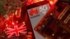 FILE - The British flag and a smartphone with a Huawei and 5G network logo are seen on a PC motherboard in this illustration picture taken January 29, 2020.