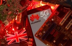 FILE - The British flag and a smartphone with a Huawei and 5G network logo are seen on a PC motherboard in this illustration picture taken Jan. 29, 2020.