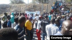 People milling around one of the border posts today following a protest over an import ban on basic commodities. 