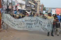 A banner hangs in Shaheen Bagh, where women are vowing to continue to protest the citizenship law in India. (Anjana Pasricha/VOA)