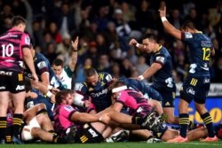 The Highlanders celebrate after scoring their first try during the Super Rugby Aotearoa rugby game between the Highlanders and Chiefs in Dunedin, New Zealand, June 13, 2020. It was the first major rugby union tournament since the COVID-19 outbreak.