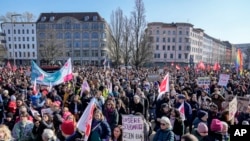 People march during an International Women's Day demonstration in Berlin, Germany, Friday, March 8, 2024.