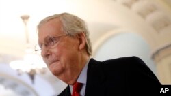 FILE - Senate Majority Leader Mitch McConnell of Kentucky walks to his office on Capitol Hill in Washington, April 9, 2020.