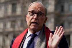 FILE - White House chief economic adviser Larry Kudlow talks to reporters about the economic impact of the coronavirus, at the White House, March 16, 2020.