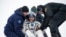 Expedition 38 Flight Engineer Mike Hopkins of NASA gives a thumbs up as he is helped from the Soyuz Capsule just minutes after he, Commander Oleg Kotov of the Russian Federal Space Agency and Flight Engineer Sergey Ryazanskiy of Roscosmos, landed in their Soyuz TMA-10M spacecraft near the town of Zhezkazgan, Kazakhstan.