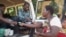 Flood survivors receive medication during mobile clinic hours in Machinga district.