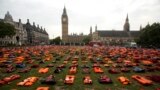 About 2,500 lifejackets worn by refugees, who made the sea crossing from Turkey to the Greek, island of Chios, are displayed in what the organizers called a "Lifejacket Graveyard" in Parliament Square, London, with the Houses of Parliament seen in the background.