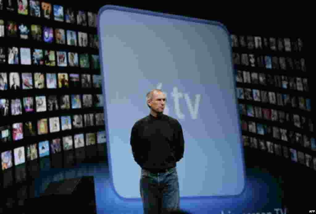 Apple CEO Steve Jobs demonstrates the new AppleTV during his keynote address at MacWorld Conference & Expo in San Francisco, Tuesday, Jan. 9, 2007. (AP Photo/Paul Sakuma)