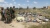 نبش قبر برای یافتن اجساد کشته شدگان در تکریت