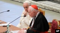FILE - Pope Francis listens to Cardinal Marc Ouellet speak at an event at the Vatican on Feb. 17, 2022. The Holy See said on April 13, 2024, that it has protested to France after a French court ruled Ouellet was liable for the wrongful dismissal of a nun from a religious order.