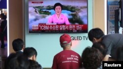 People watch a TV news report about North Korea's hydrogen bomb test at a railway station in Seoul, South Korea, Sept. 3, 2017. 