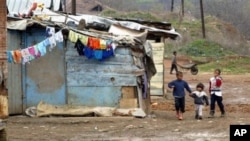 Roma children play near the lead polluted Trepca industrial complex in the makeshift camp of Zitkovce, near Kosovska Mitrovica, Kosovo (File Photo - 04 Apr 2004)